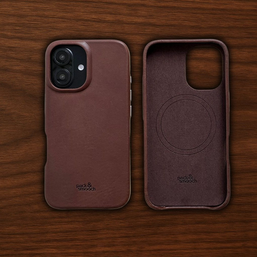 Leather iPhone case in dark brown on the iPhone 16, outside and inside side by side on wood, model CHESTER